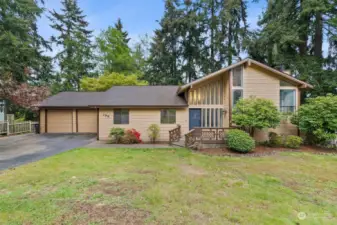 LARGER THAN IT LOOKS | This tri-level home features 3,772 sf of living space! And in the wonderful, established neighborhood called "The Woods." All on a .29 acre lot on a dead-end street that feels huge and private surrounded by evergreens.