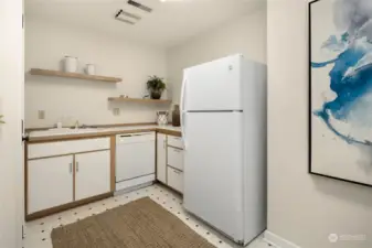 Lower level storage room with dishwasher, sink and refrigerator