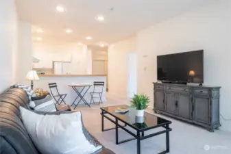 Open layout between living room and kitchen.
