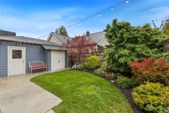 A detached garage plus storage shed are both accessed just steps from the home's back door.