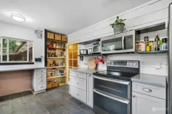 Built-in microwave and plenty of shelving and cabinet space.