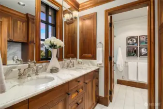 Upper Level Guest Bathroom w/ soaking tub, dual vanities, calacatta marble countertops and flooring & in-floor radiant heat.