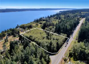 Gently sloping West down towards the water sits this 5 acre parcel in Greenbank.