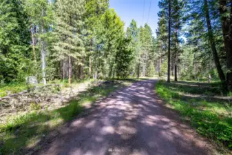 Road between two parcels with year round ease of access in Mazama.