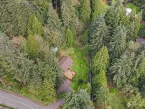 The property is marked past the driveway on Larch Way in black.  It is staed on the driveway to Lot 2 the property line.  Marked on North side as well.