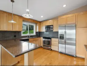 All stainless appliances & ample cabinets round out this beautiful kitchen.