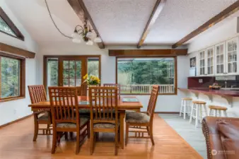 Dining Room enjoys picture windows and a door to the deck