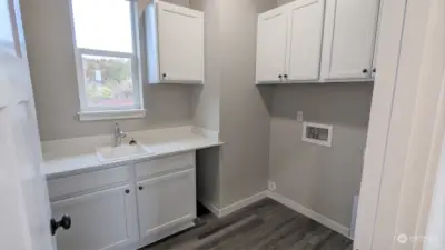 Laundry Room on Main -  - Photos from finished Ellington on another lot in community. Finishes and options will vary.