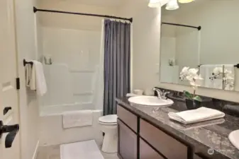 The hall bath also has 2 sinks, granite counters, and access to one bedroom.