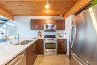 Check out the beautiful rich, dark wood cabinets & all the appliances you'll need