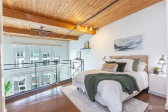 Spacious primary bedroom with rare high ceiling loft layout