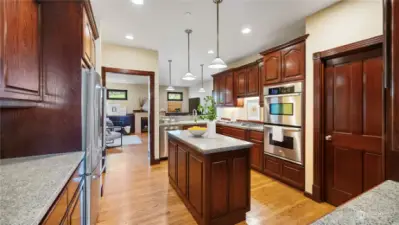 Kitchen with ample counter space, lots of cabinets and a walk-in pantry.