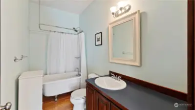 Additional suite bathroom with traditional claw foot tub.