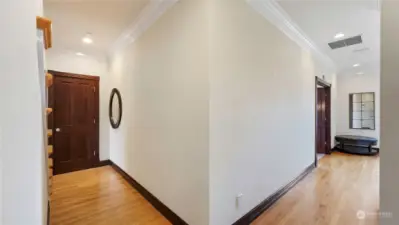 Hallway with hardwood floors.