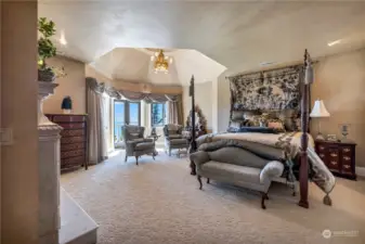 Second Primary Bedroom with Vaulted ceilings over a special chandelier. French Doors lead out to a private Balcony to enjoy the Bay Views. Room also has spacious walk in closet.