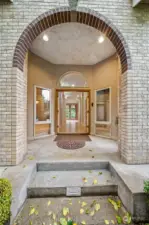 Brick arched entry with double doors really makes a nice statement.