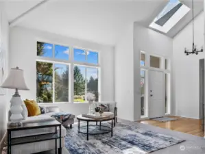 The vaulted ceiling, skylight and the multitude of windows enhance your experience as you enter. The interior of the home was just painted and the classic neutral color is a great backdrop for any decor.