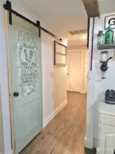 Hallway with custom pantry door