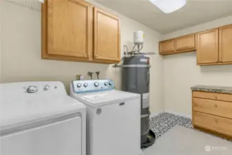 There is plenty of storage in the utility room and the hot water tank is 3 years old. Newer flooring with a wonderful design.