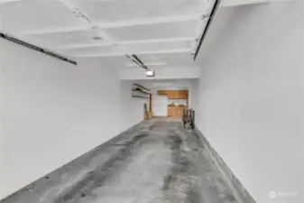 HUGE 2+ tandem garage! There is a door to the left that will lead you to a hallway to stairs or the elevator. It's your choice!