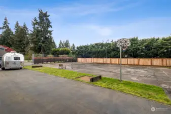 Tennis enthusiasts will be thrilled to discover a lighted sports court, complete with net and basketball hoop. Prefer pickle ball? Room for that, too. Lots of opportunity for friendly matches or competitive play. There's even a horseshoe pit and an extensive amount of room for RV parking.