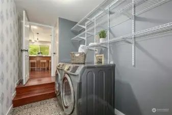This laundry room has a good amount of storage space.