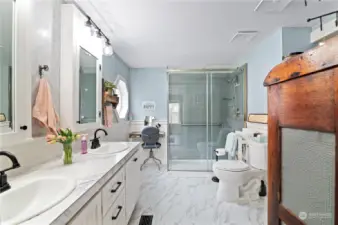 Primary bath with double sink vanity and walk in shower