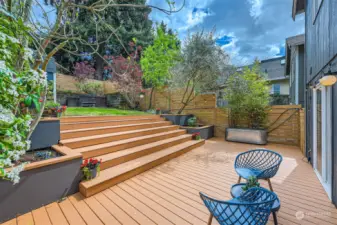 Deck leads up to gardening space, hot tub.