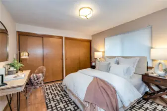 Second main level bedroom boasts hardwood floors and ample closet space