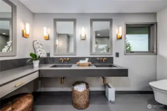 Spacious and sophisticated with beautiful fixtures that echo the design language of the kitchen and downstairs bathroom for a cohesive feel throughout the home