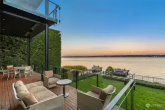 Outdoor deck and entertaining spaces. Large and fully fenced level yard with low bank water access, modern dock with boat lift and secondary lift ideal for water toys, paddle boards, etc.