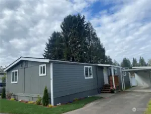 Spacious "Turn-key" Doublewide at well kept, quiet, no age restricted EdgeLake MHPark.   Carport + Storage, driveway fits 3 cars. Lovely backyard Gazebo/Patio on waterfront.