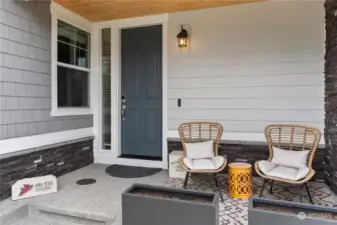 A covered front porch extends a warm invitation to this delightful home!