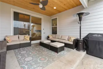 Sliding doors off the dining area lead to this covered patio.