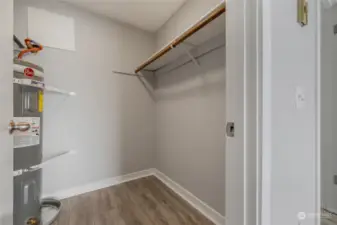 Walk-in closet with ample storage.