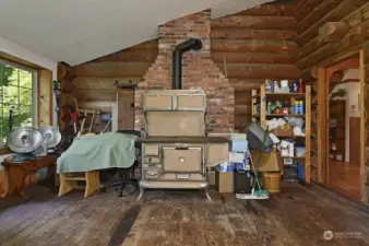 The backroom with antique stove was used for storage. This is yet another great space for work, hobby & play, or could make a lovely garden room.