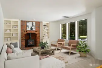 Family room with fireplace & large windows