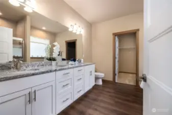 Master bath with dual sinks is beautiful and bright.