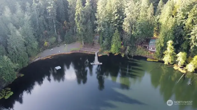 AERIAL OF LOST LAKE LOOKING AT THE CLUBHOUSE, DOCK AND FLOATING DOCK