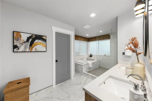 This primary bath will WOW you everytime; featuring stunning continuous marbled flooring, dual-sink vanity, standalone-tub, massive walk-in rain shower and discreet water closet.