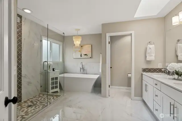 Luxury spa bathroom en suite. Full remodel. Dual sinks. Soaking tub. Large frameless glass shower ceramic tile. Quartz. Marble. Amber Ridge Bothell. Kat Hartnell Engel and Voelkers Seattle Eastside.
