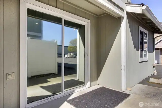 Step onto our patio and let the fresh breeze kiss your cheeks as you soak up the sunshine. With every sip and every smile, feel the zest for life refresh your spirit in this delightful alfresco oasis. The bedroom windows and the slider have a privacy protective film.