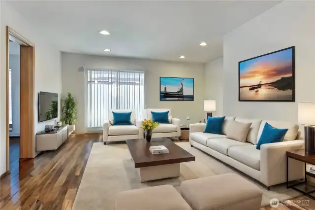 Virtually Staged. Welcome to the heart of our home, where warmth and comfort embrace you in every corner. Step into our inviting living room, a haven designed for creating cherished memories with loved ones. Sink into plush sofas, enveloped in soft throws, as the gentle glow of ambient lighting sets the perfect mood for cozy conversations and laughter. With ample space for gathering and relaxation, this room beckons you to unwind, connect, and make unforgettable memories in the embrace of cozy tranquility.
