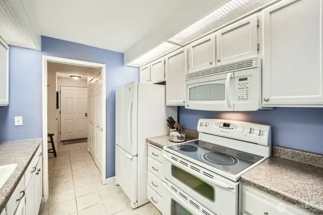 Spacious kitchen with lots of counterspace and storage.