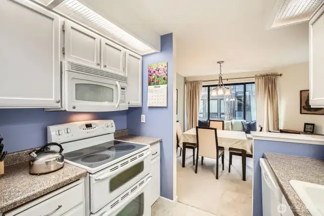 Kitchen adjoins dining room.