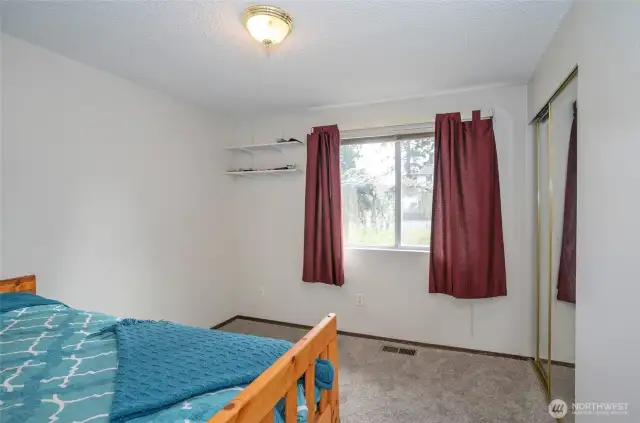 Guest suite offers plenty of natural light and new carpeting throughout.