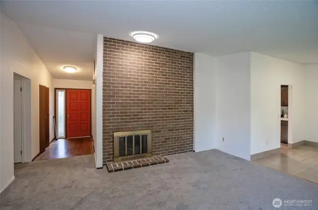 Step inside to find the family room to your left and the main living area straight ahead, featuring brand-new carpeting.