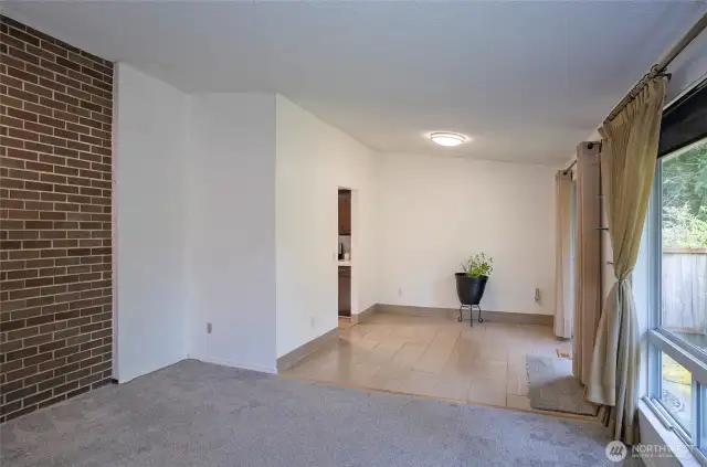 The dining area flows seamlessly into the kitchen through the open doorway.