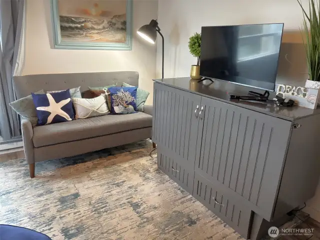 The cabinet on the right opens up to a fold-out bed.