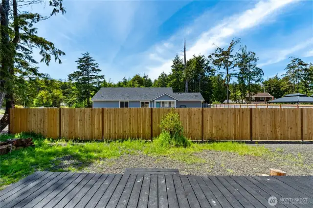 Newer privacy fence to the west